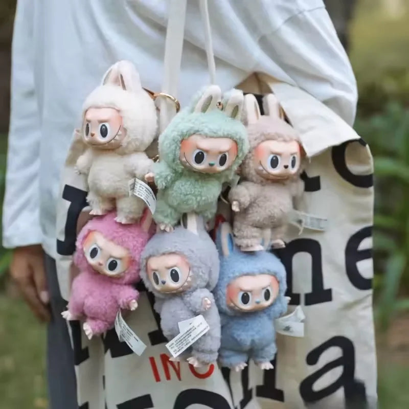 Labubu The Monster Vinyl Face Doll Heart Moving Macaron Doll Blind Box Blind Bag Figure Guessing Bag China High Quality Replica